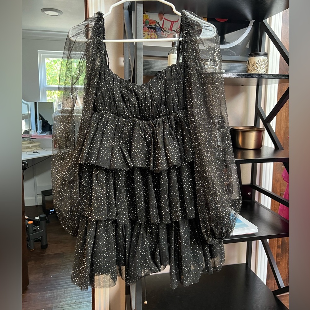 Tiered black and gold mini dress with puff sleeves